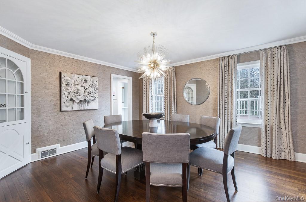94 Round Hill Road Scarsdale, NY 10583 - Photo 7 of 46 Across the entrance hall, a beautiful formal dining room presents an elegant setting for formal entertaining and special gatherings.