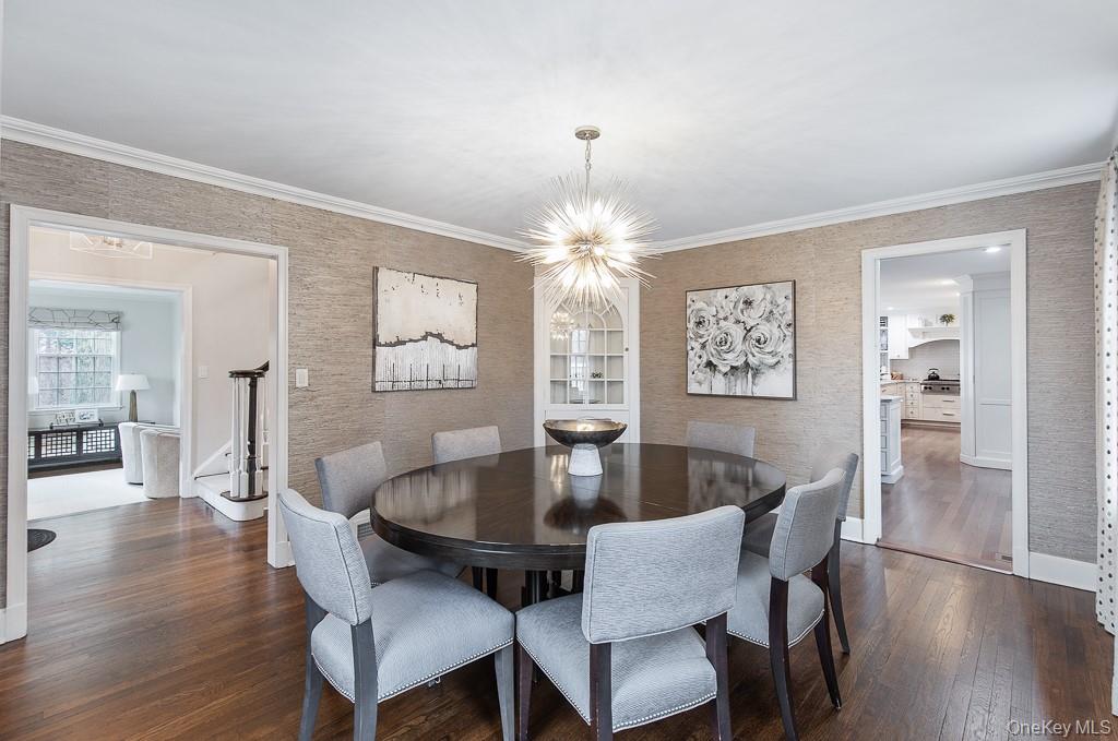 94 Round Hill Road Scarsdale, NY 10583 - Photo 8 of 46 Alternative view of the formal dining room showcases the center hall layout and direct access to the butler's pantry and eat-in kitchen.