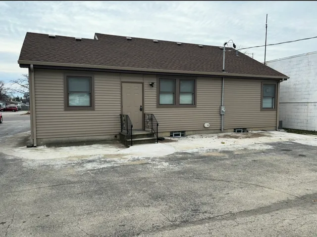 a room with stairs and a wooden floor