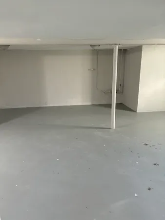 an empty room with wooden floor