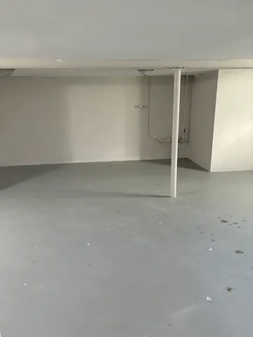 an empty room with wooden floor