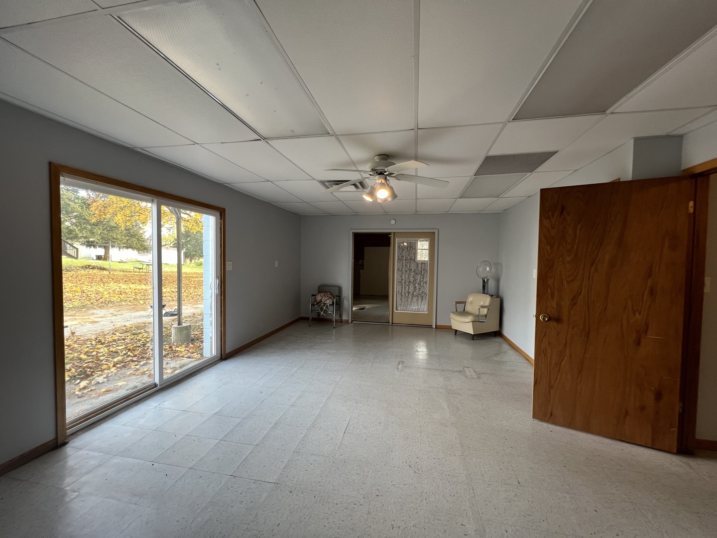303 East State Road Mount Carroll, IL 61053 - Photo 22 of 26 a view of a livingroom with an empty space and a window