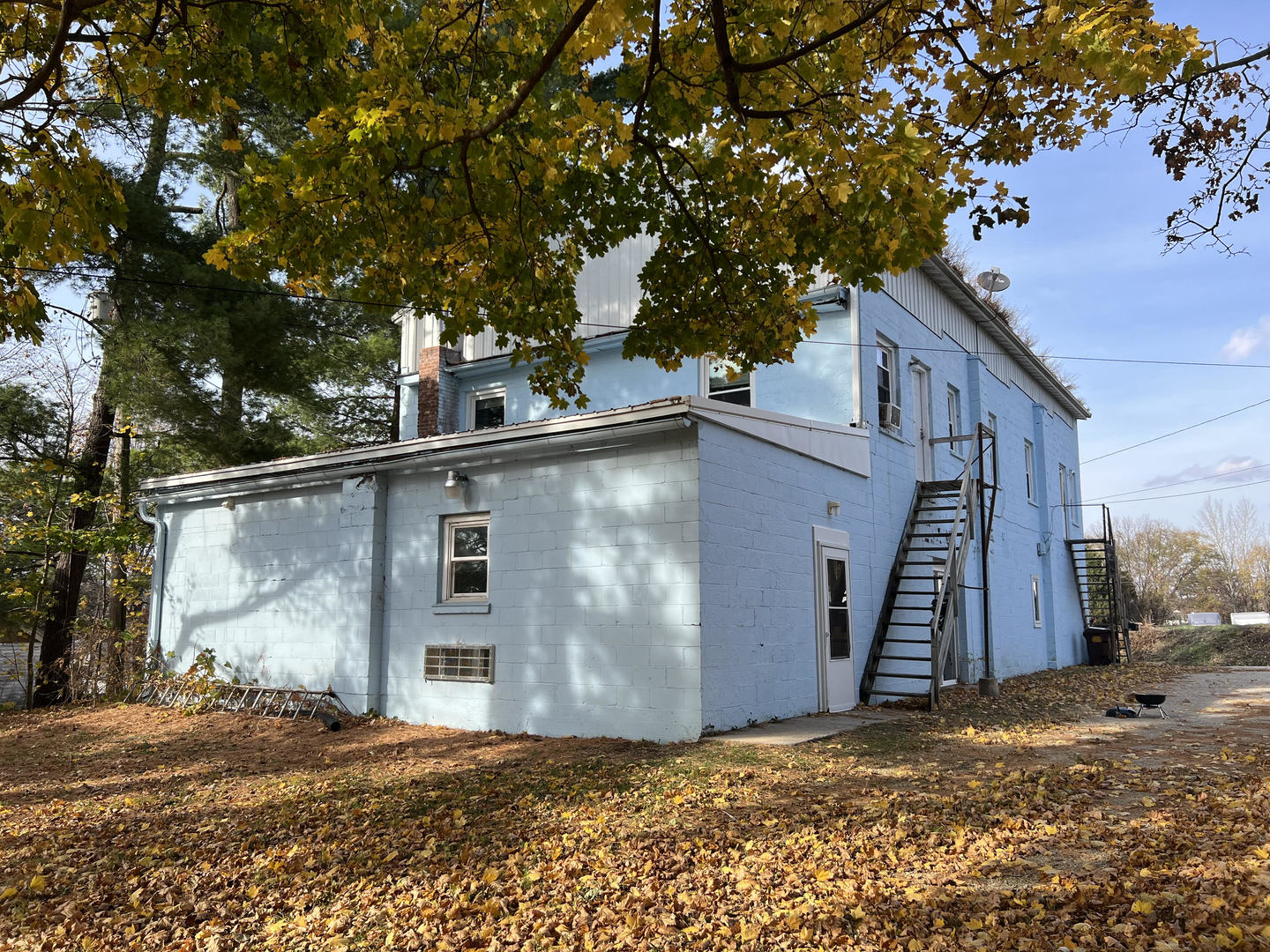 303 East State Road Mount Carroll, IL 61053 - Photo 7 of 26 a view of a house with a yard