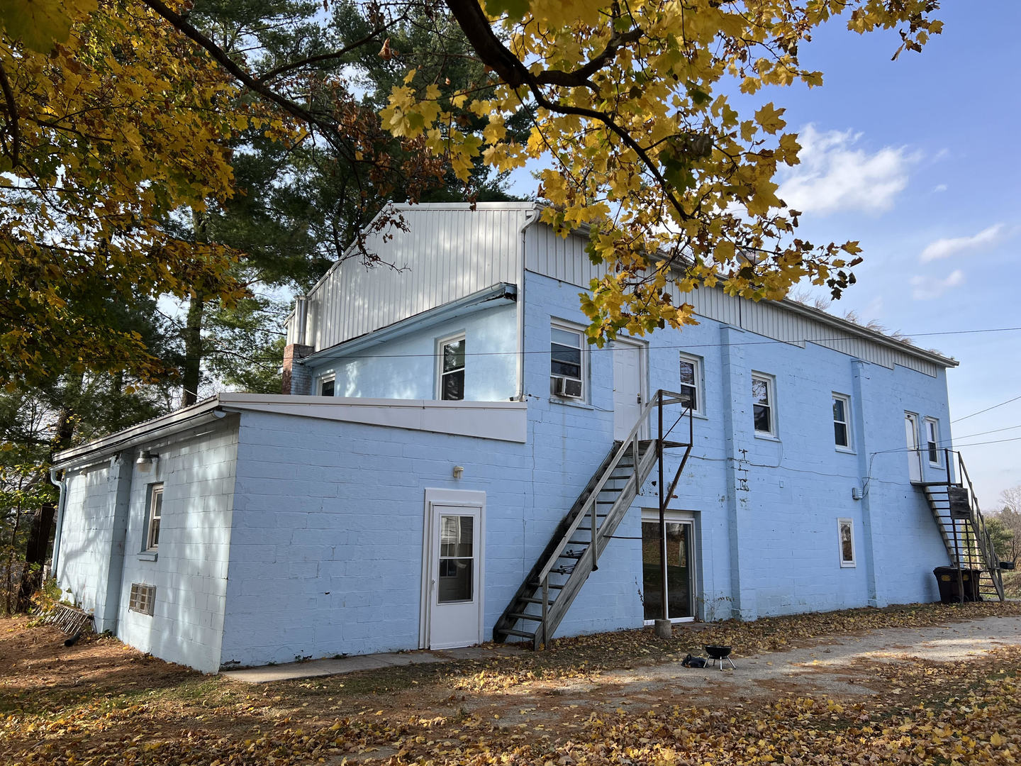 303 East State Road Mount Carroll, IL 61053 - Photo 8 of 26 a view of a house with a tree