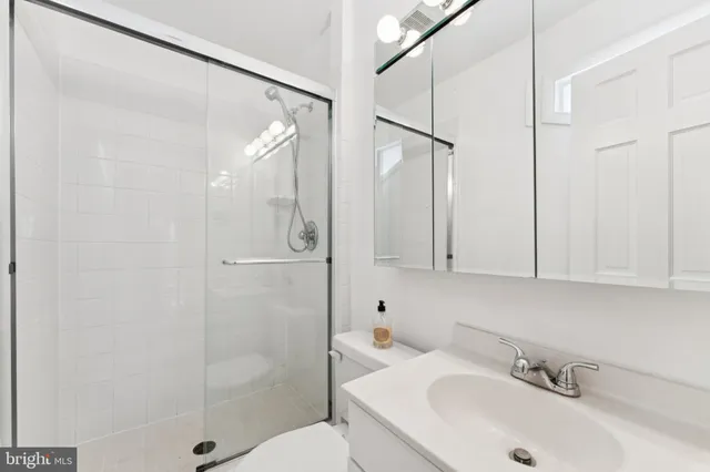 a bathroom with a sink and shower