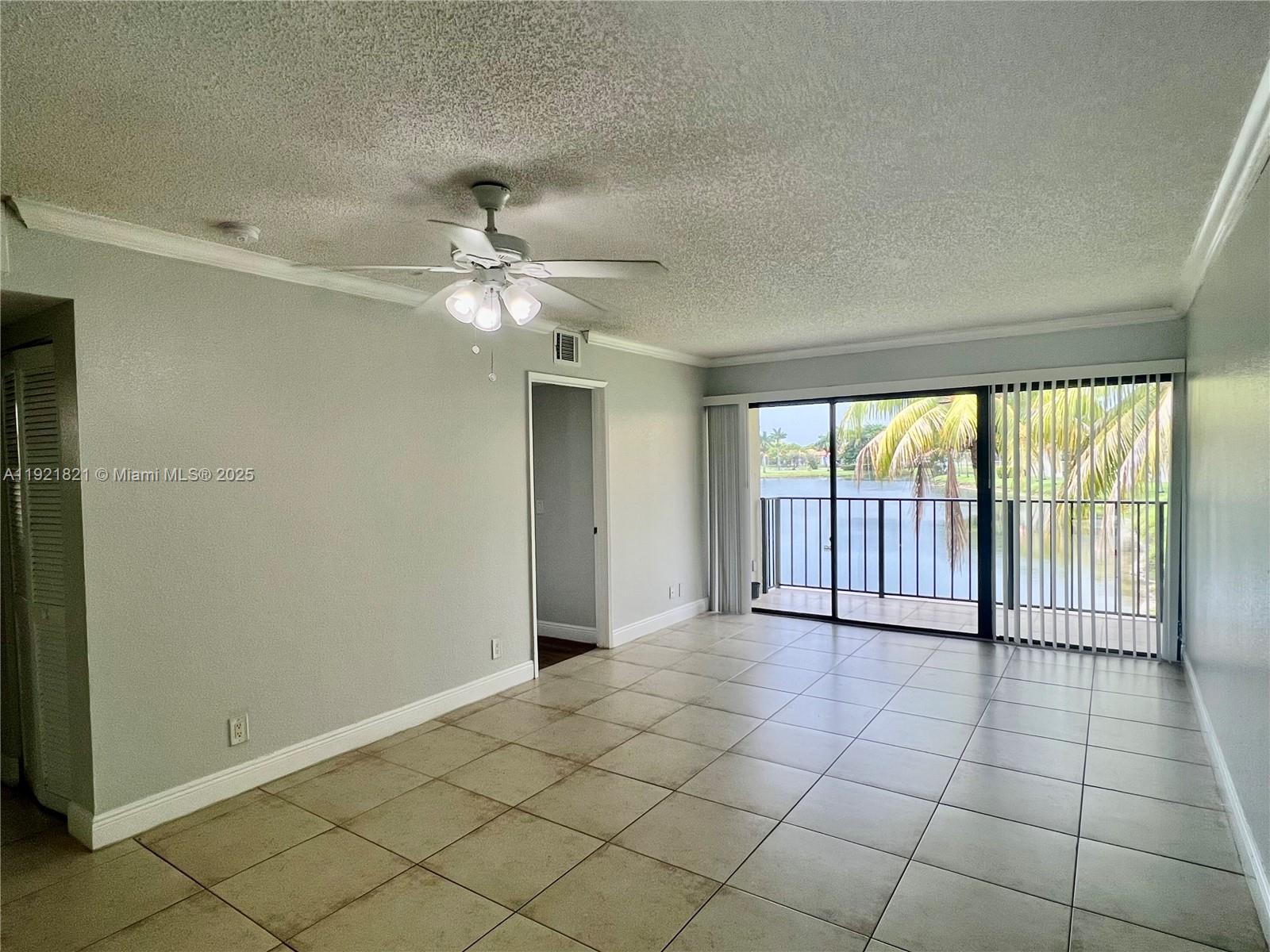1477 Lake Crystal Drive, Unit F West Palm Beach, FL 33411 - Photo 5 of 16 a view of an empty room and window