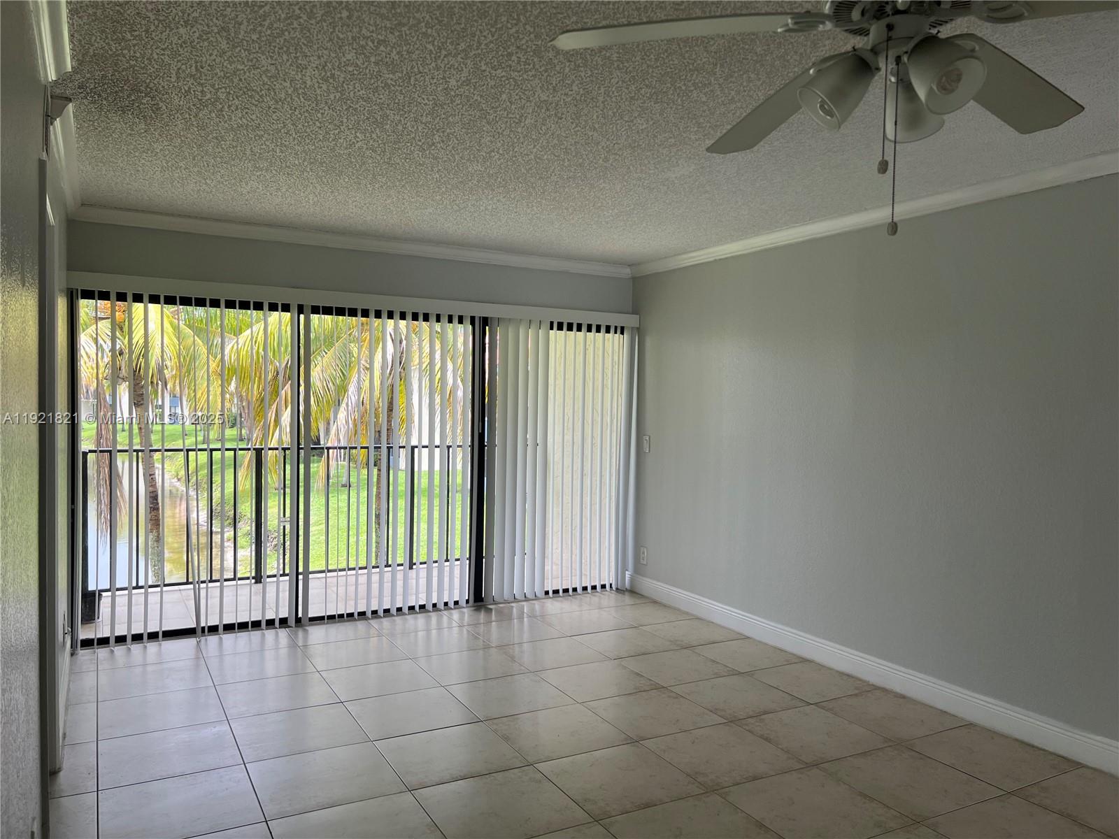 1477 Lake Crystal Drive, Unit F West Palm Beach, FL 33411 - Photo 6 of 16 a view of an empty room and window