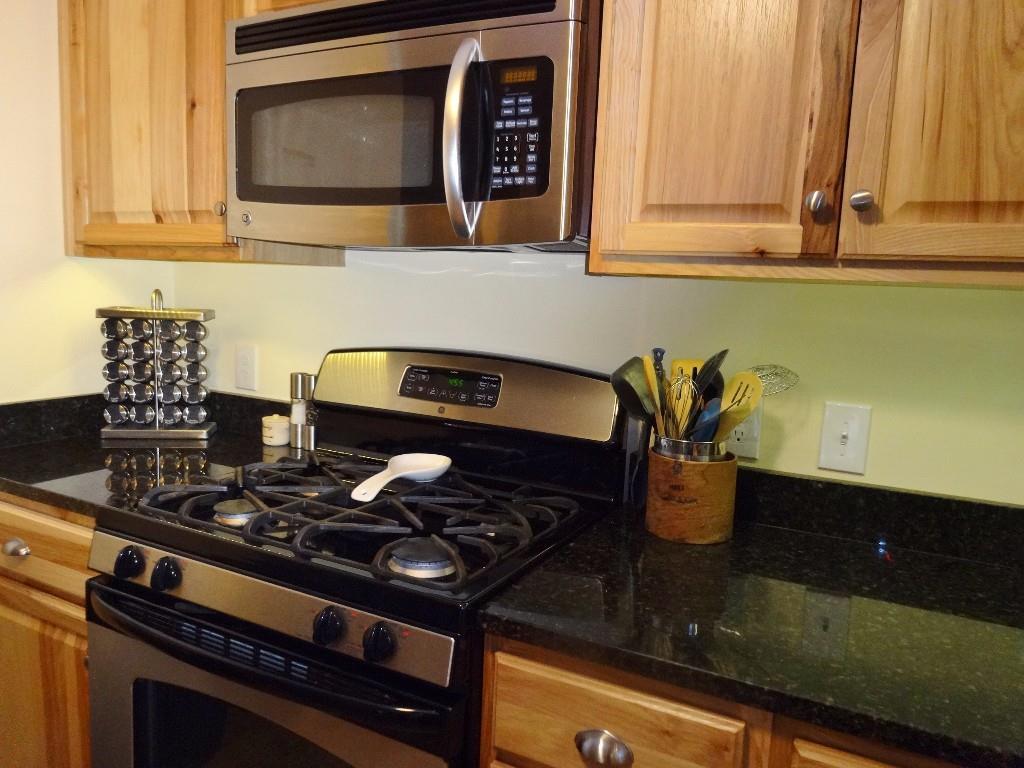 687 Stream Road Winterport, ME 04496 - Photo 13 of 35 Stainless gas cookstove and matching...