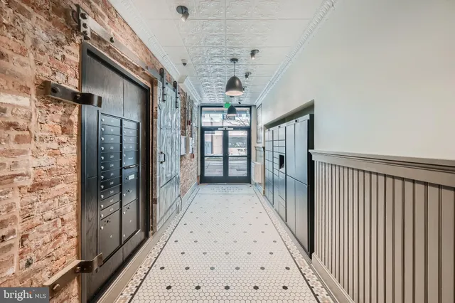 a view of hallway with chandelier