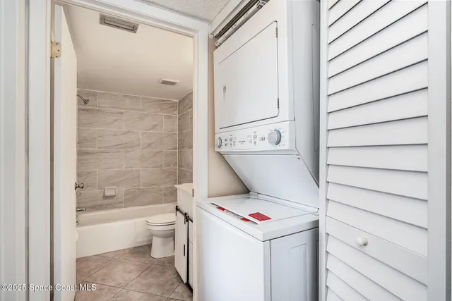a bathroom with a toilet and a bathtub