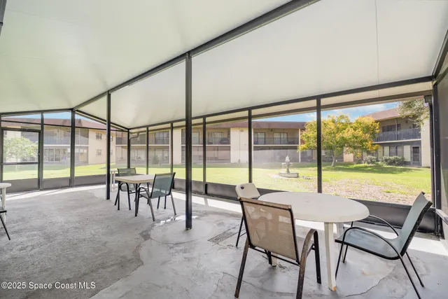 a dining area with furniture and outdoor view