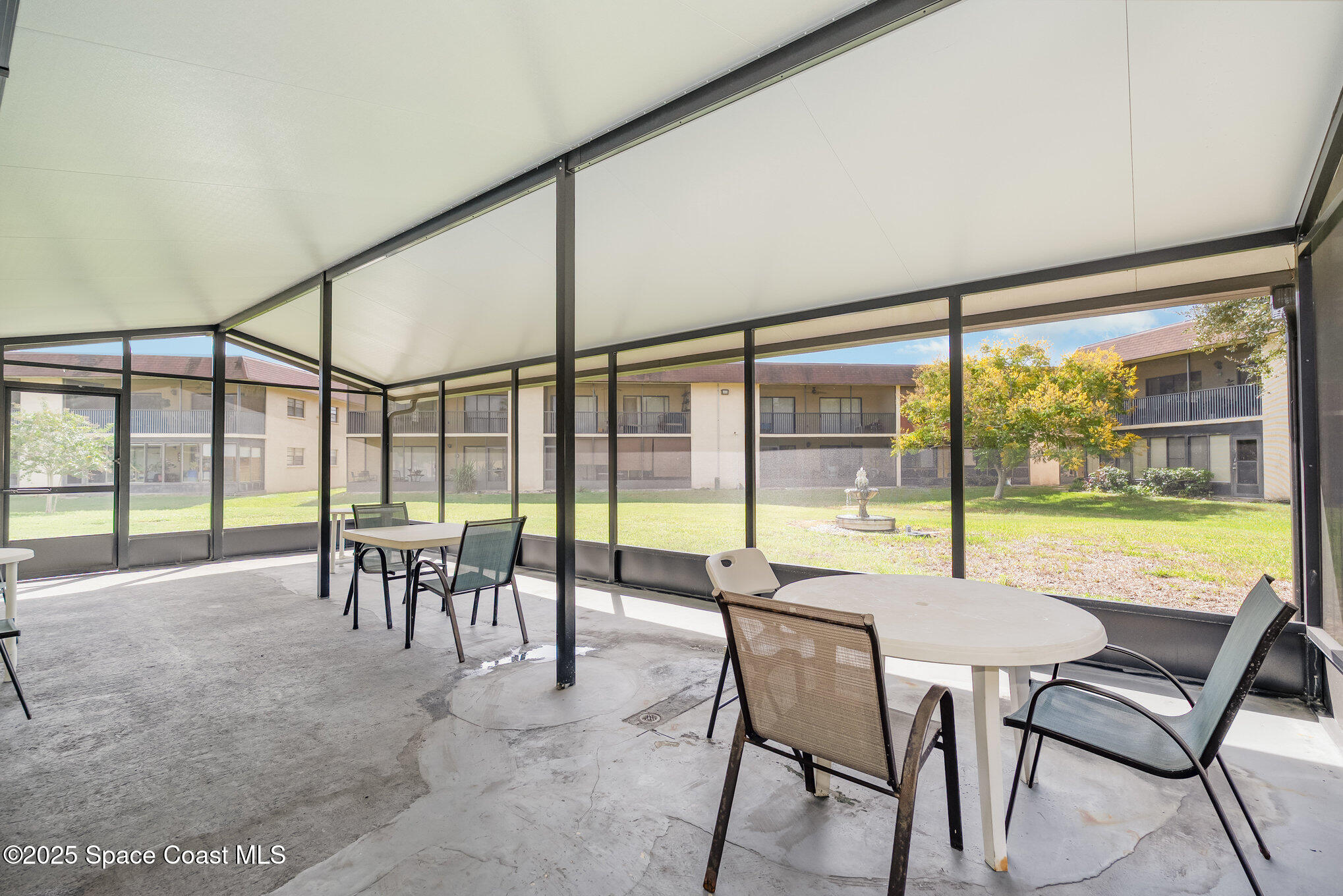 205 Palmetto Avenue, Unit 410 Merritt Island, FL 32953 - Photo 15 of 19 a dining area with furniture and outdoor view