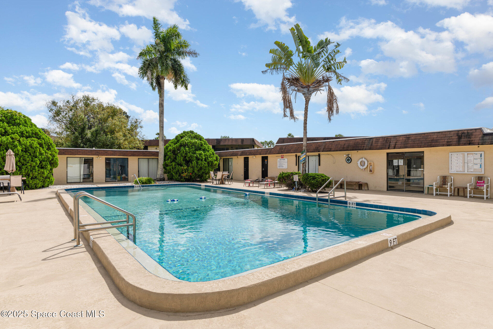205 Palmetto Avenue, Unit 410 Merritt Island, FL 32953 - Photo 17 of 19 a view of a house with swimming pool