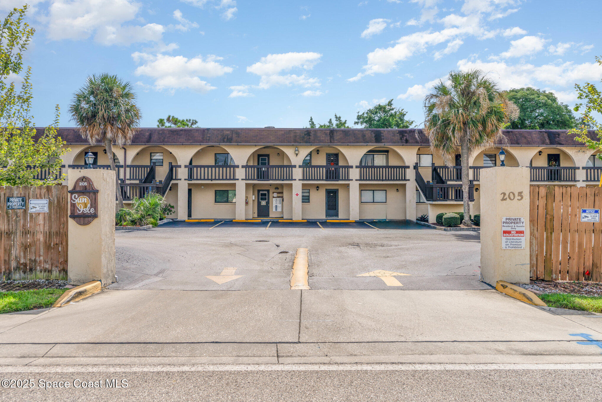 205 Palmetto Avenue, Unit 410 Merritt Island, FL 32953 - Photo 19 of 19 front view of a house with a yard