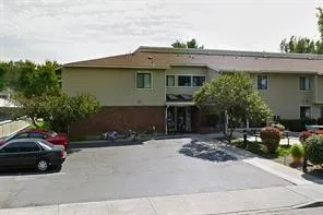 a view of a car park in front of house