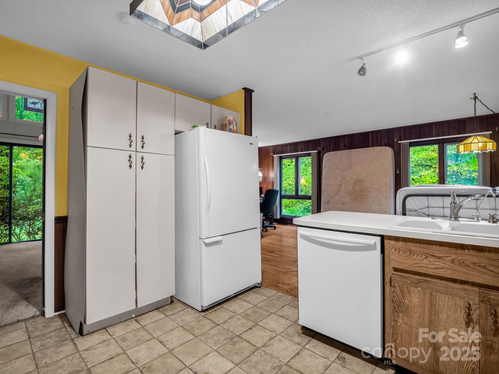 421 Chickadee Lane Brevard, NC 28712 - Photo 12 of 32 a kitchen with a refrigerator sink and stove