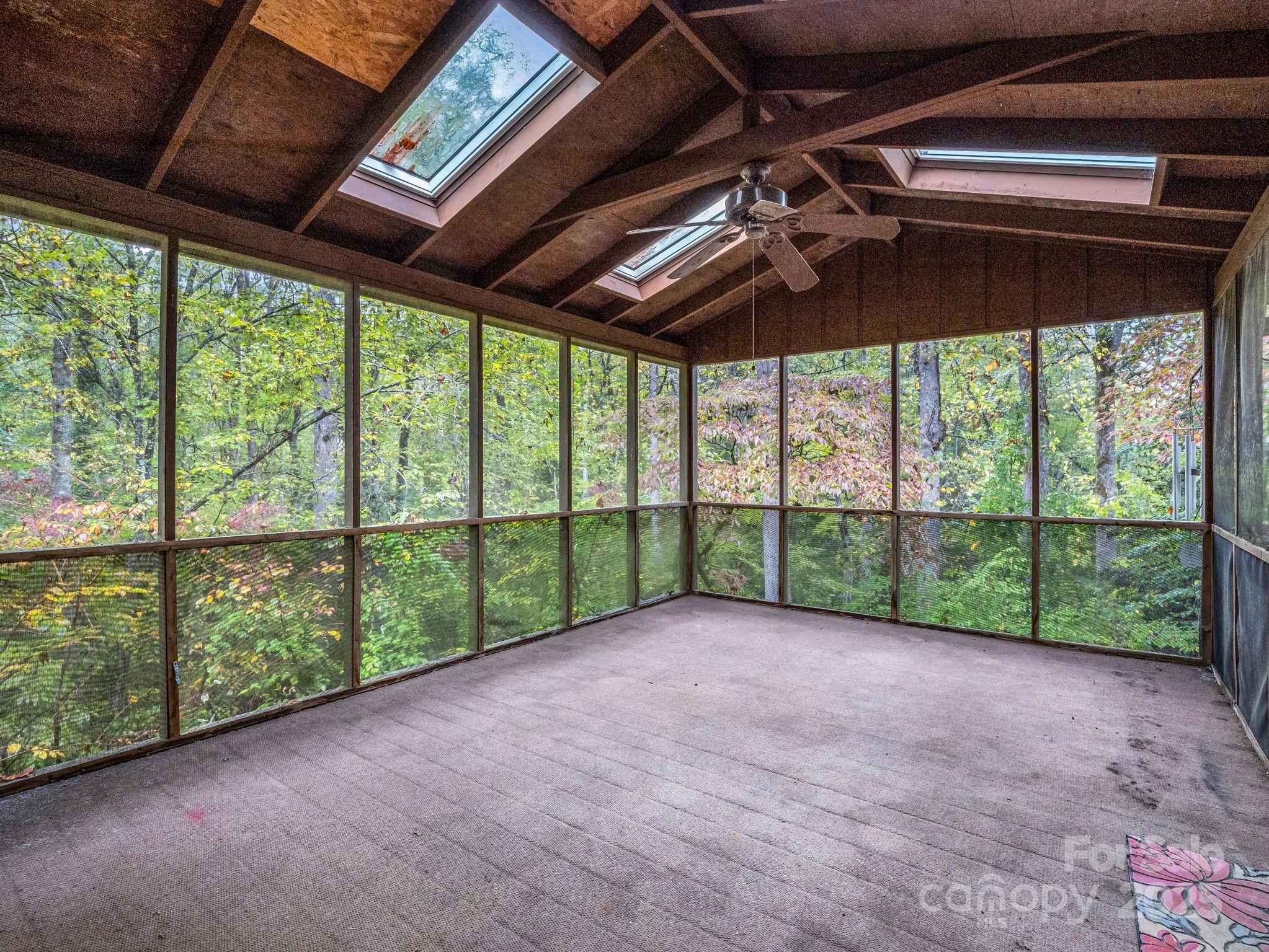 421 Chickadee Lane Brevard, NC 28712 - Photo 13 of 32 a view of a backyard of a porch