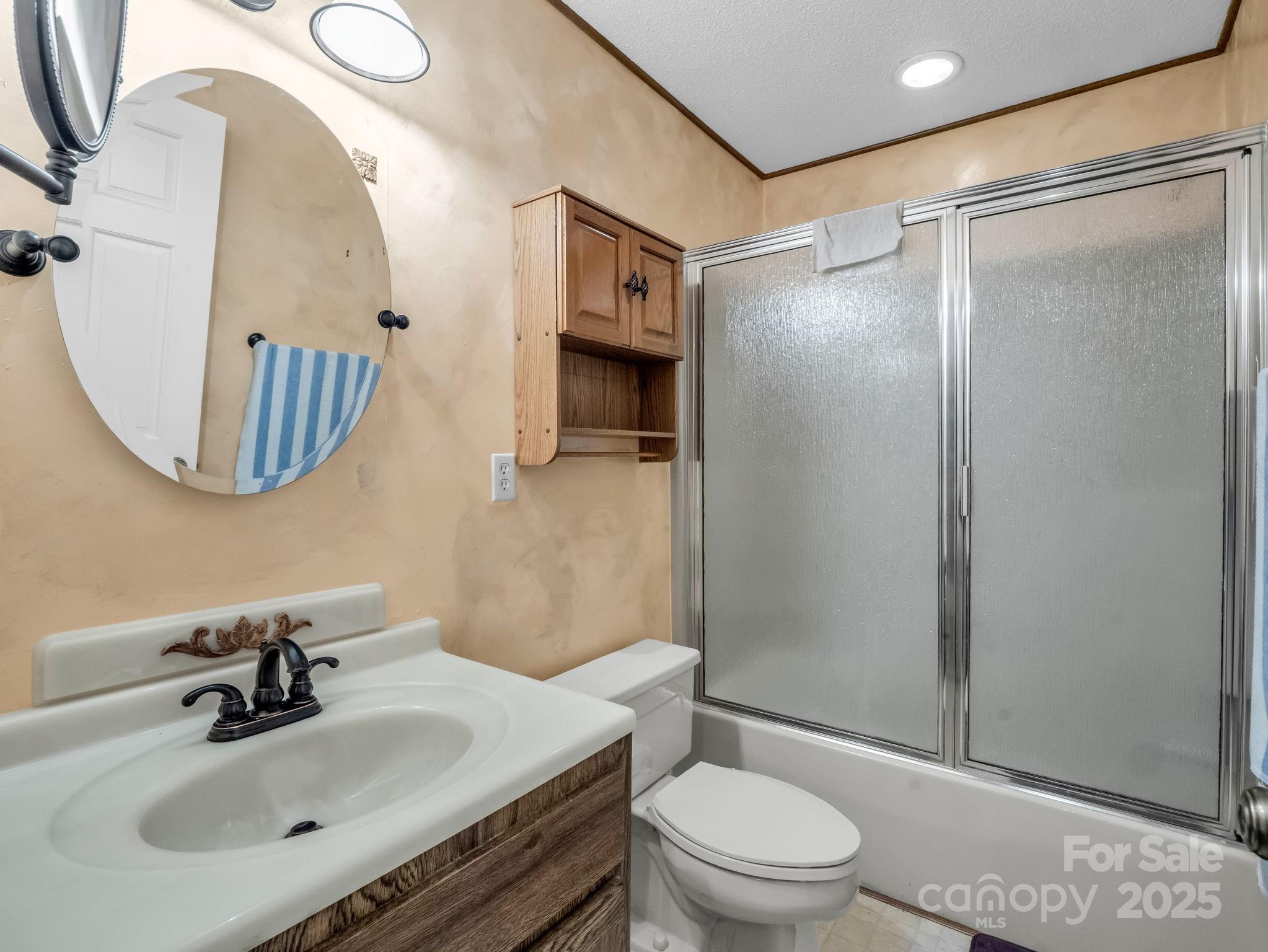 421 Chickadee Lane Brevard, NC 28712 - Photo 19 of 32 a bathroom with a sink toilet and shower