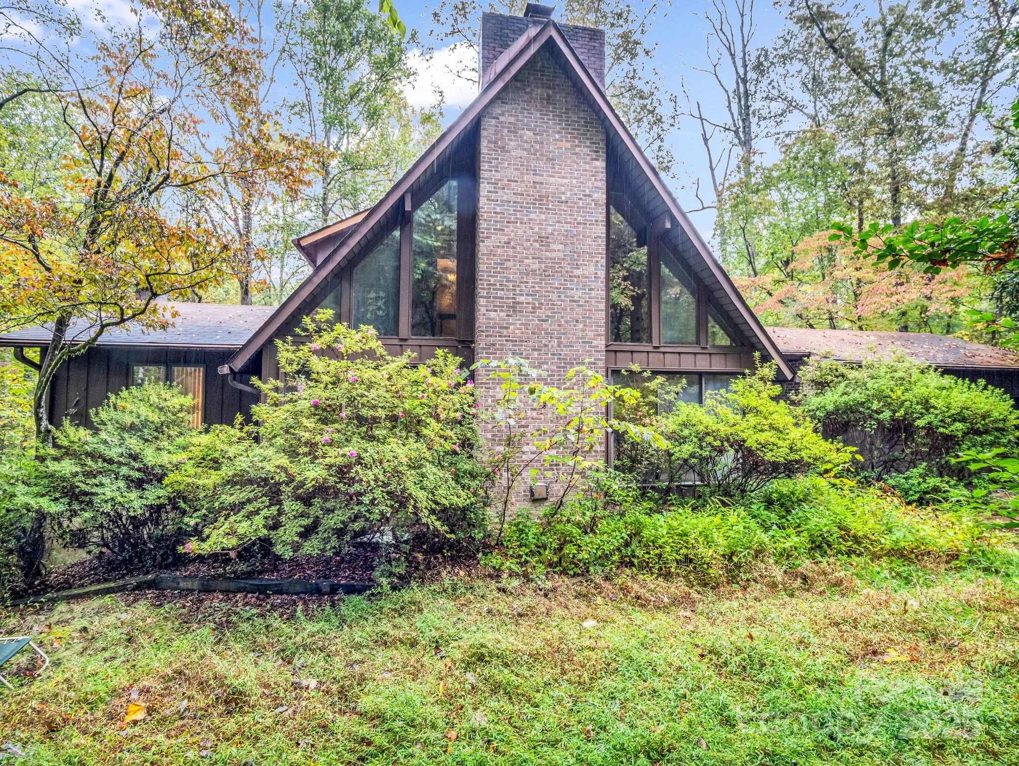 421 Chickadee Lane Brevard, NC 28712 - Photo 2 of 32 a backyard of a house with lots of green space
