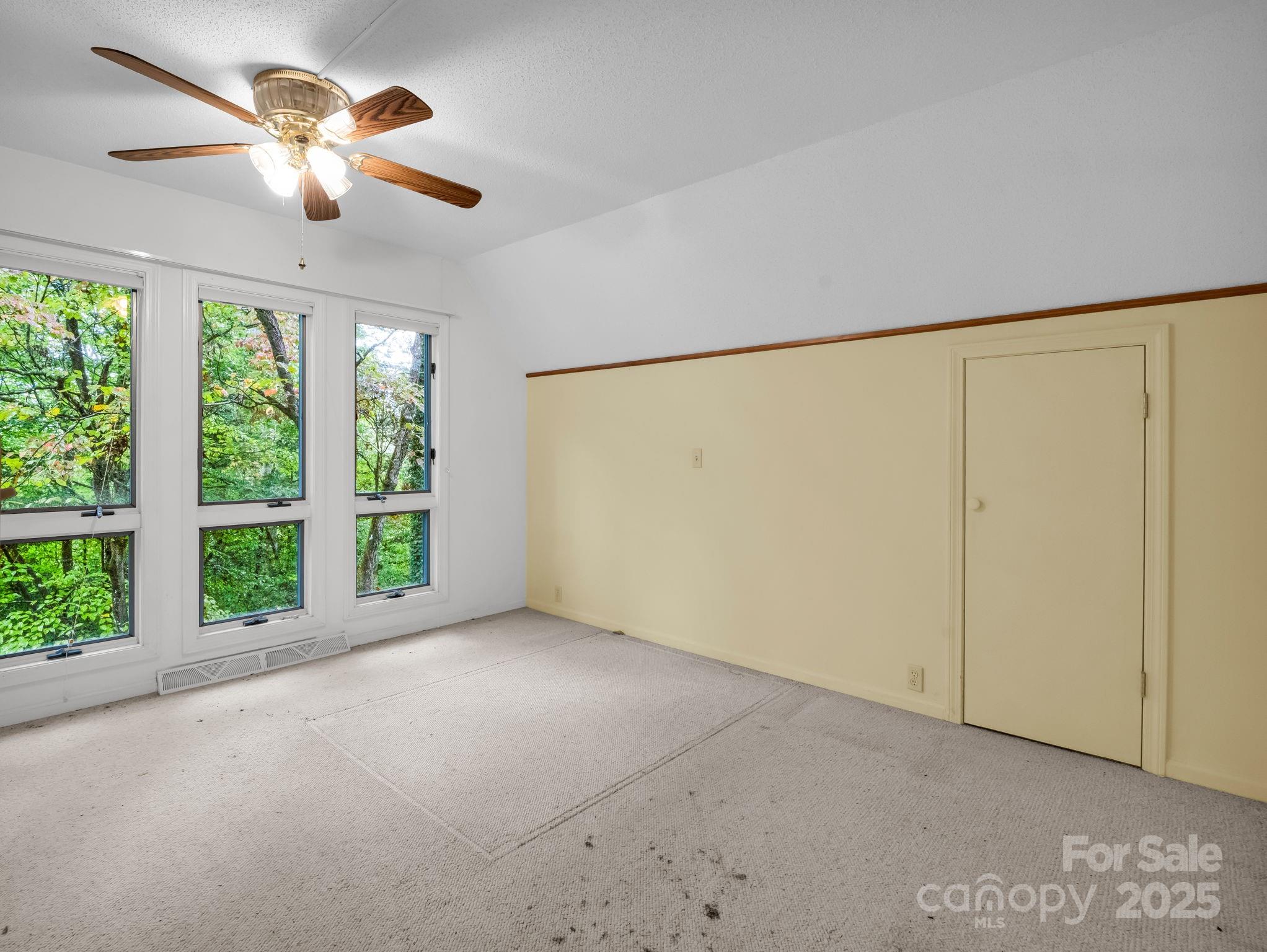 421 Chickadee Lane Brevard, NC 28712 - Photo 22 of 32 a view of an empty room with a window