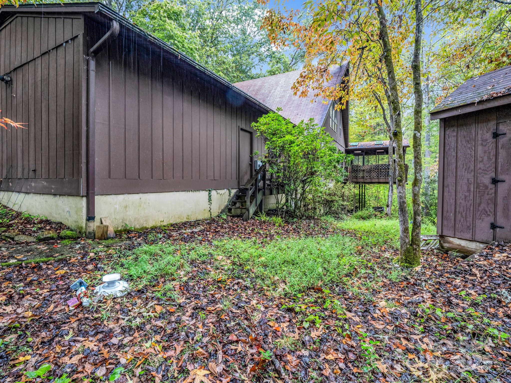 421 Chickadee Lane Brevard, NC 28712 - Photo 30 of 32 a backyard of a house with lots of green space