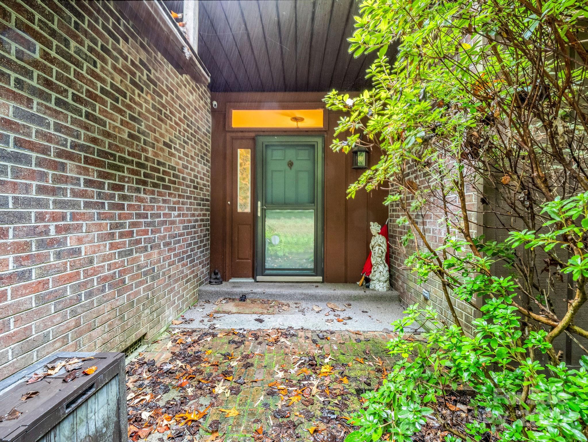 421 Chickadee Lane Brevard, NC 28712 - Photo 3 of 32 a view of a house with a small yard and plants