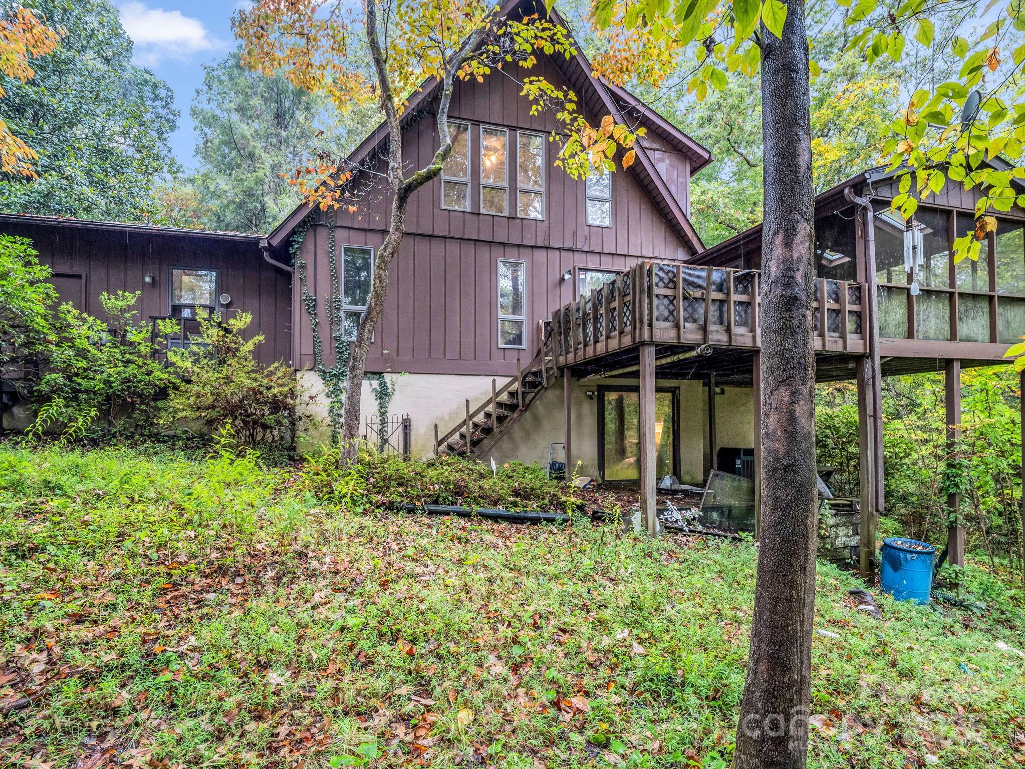 421 Chickadee Lane Brevard, NC 28712 - Photo 31 of 32 a backyard of a house with lots of green space