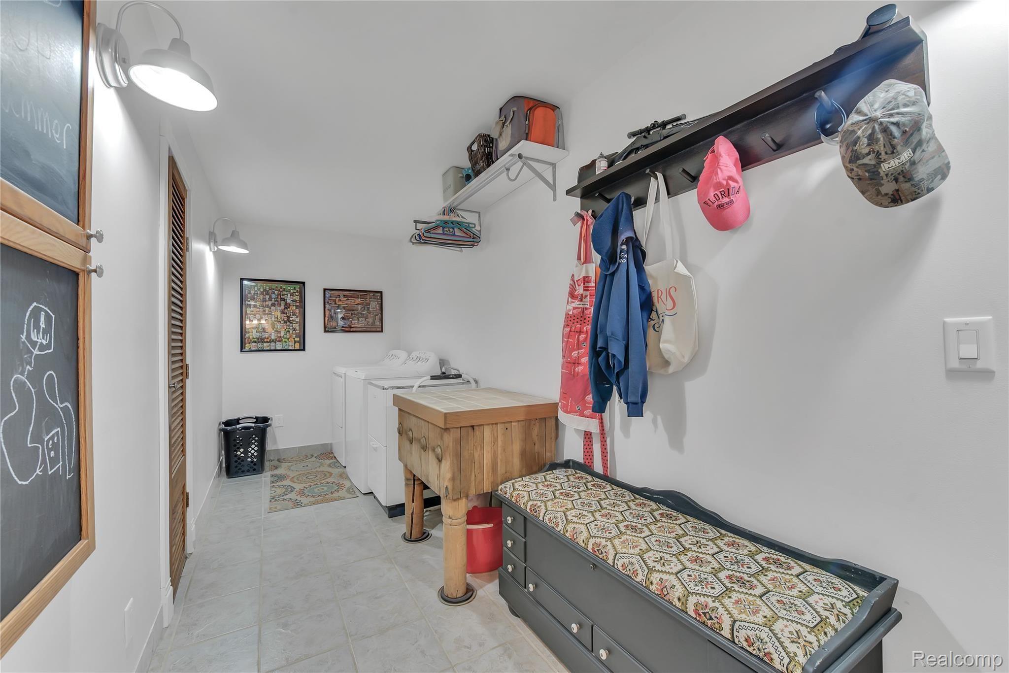 4110 Curtis Road Leonard, MI 48367 - Photo 14 of 46 massive laundry area on first floor!