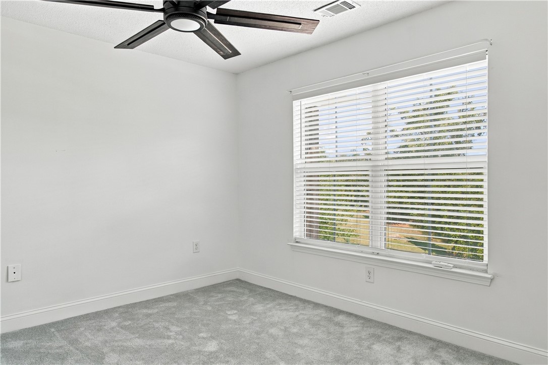 636 Lookover Drive Anderson, SC 29621 - Photo 20 of 34 Plush carpeting and a large window set a tranquil tone in this bedroom.