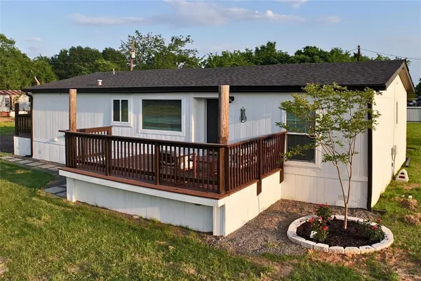 a view of a deck with a table and chairs