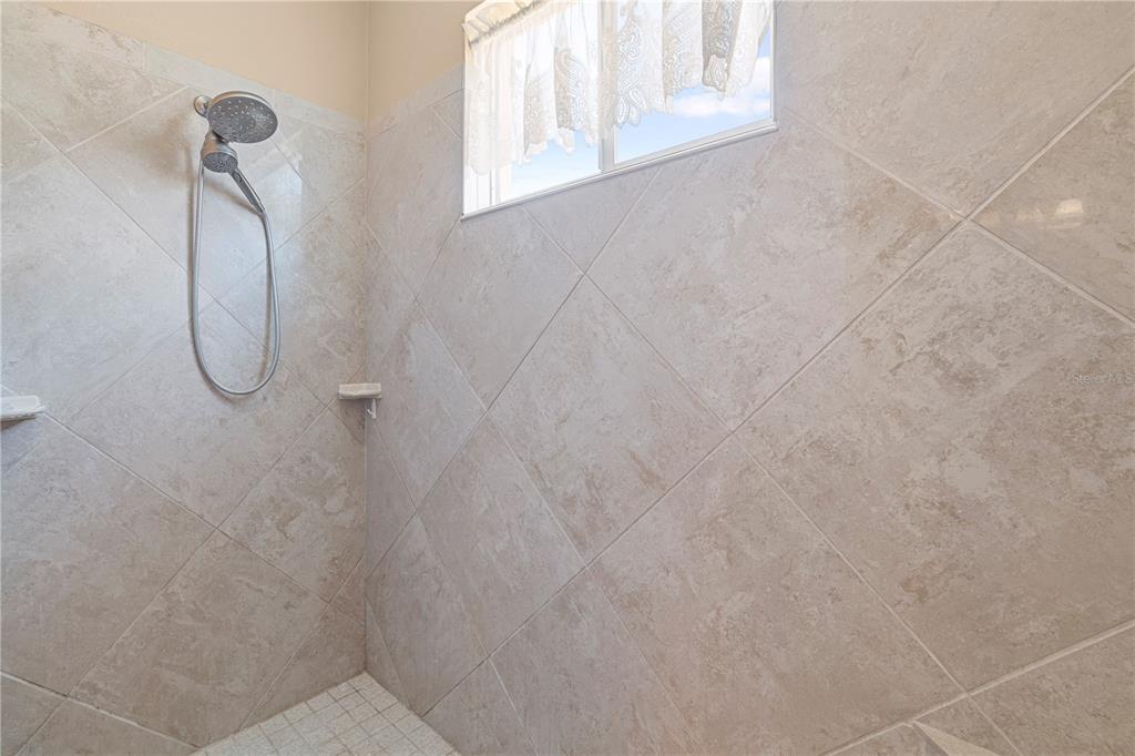 3408 Stonebridge Trail Valrico, FL 33596 - Photo 25 of 53 a bathroom with a shower