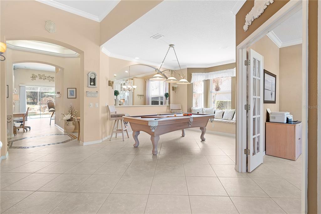 3408 Stonebridge Trail Valrico, FL 33596 - Photo 32 of 53 a room with lots of tables a large window and chairs