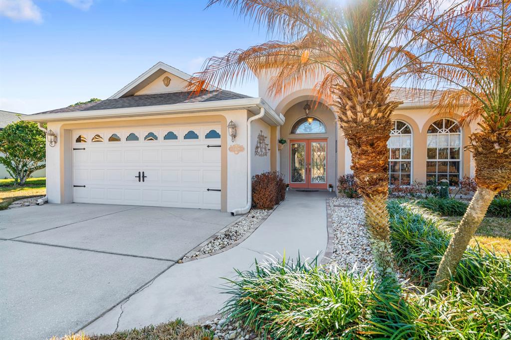 3408 Stonebridge Trail Valrico, FL 33596 - Photo 10 of 53 a front view of a house with a garage