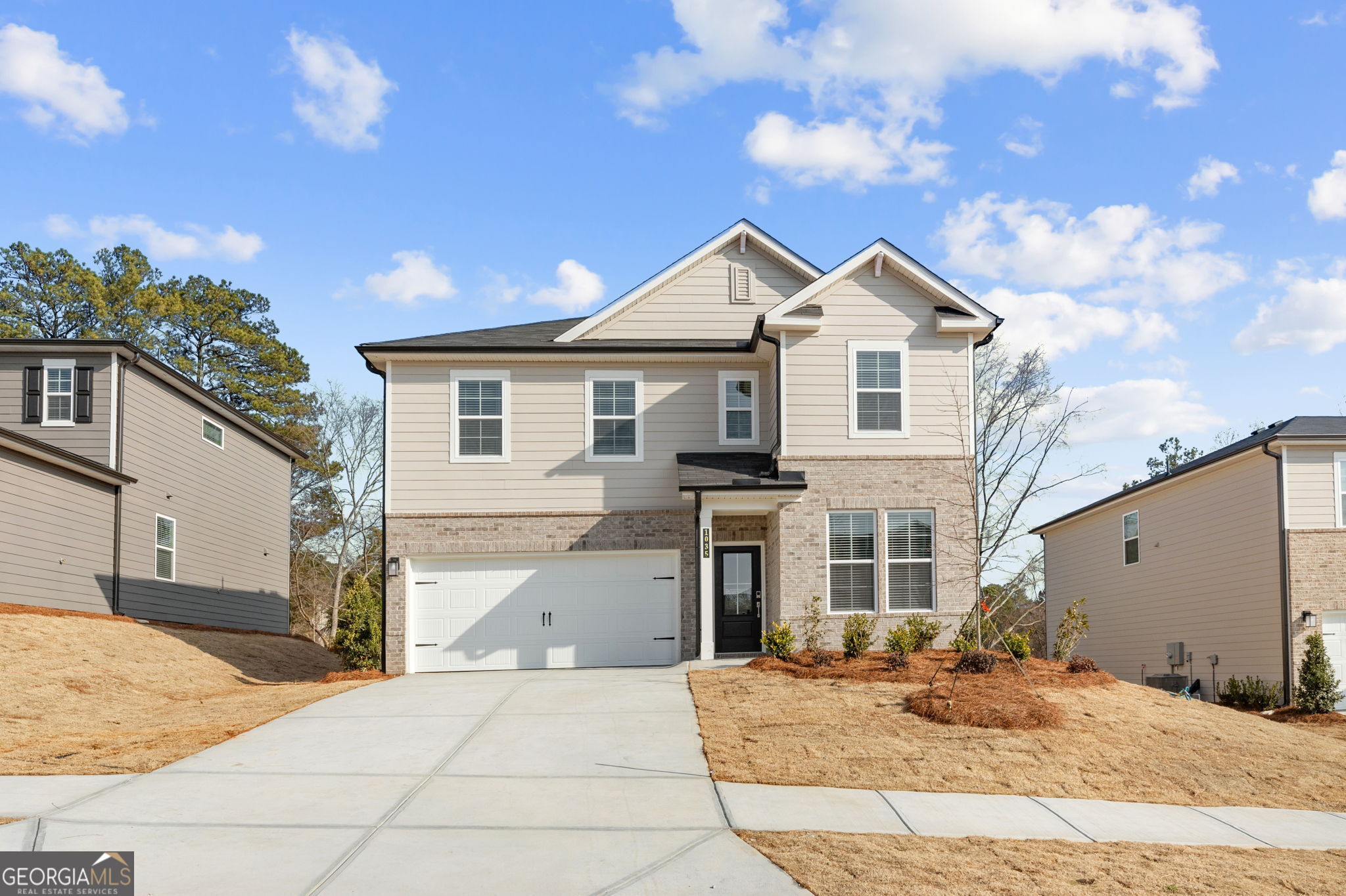 1035 Kingsley Way Lithonia, GA 30058 - Photo 1 of 1 a front view of a house with a yard