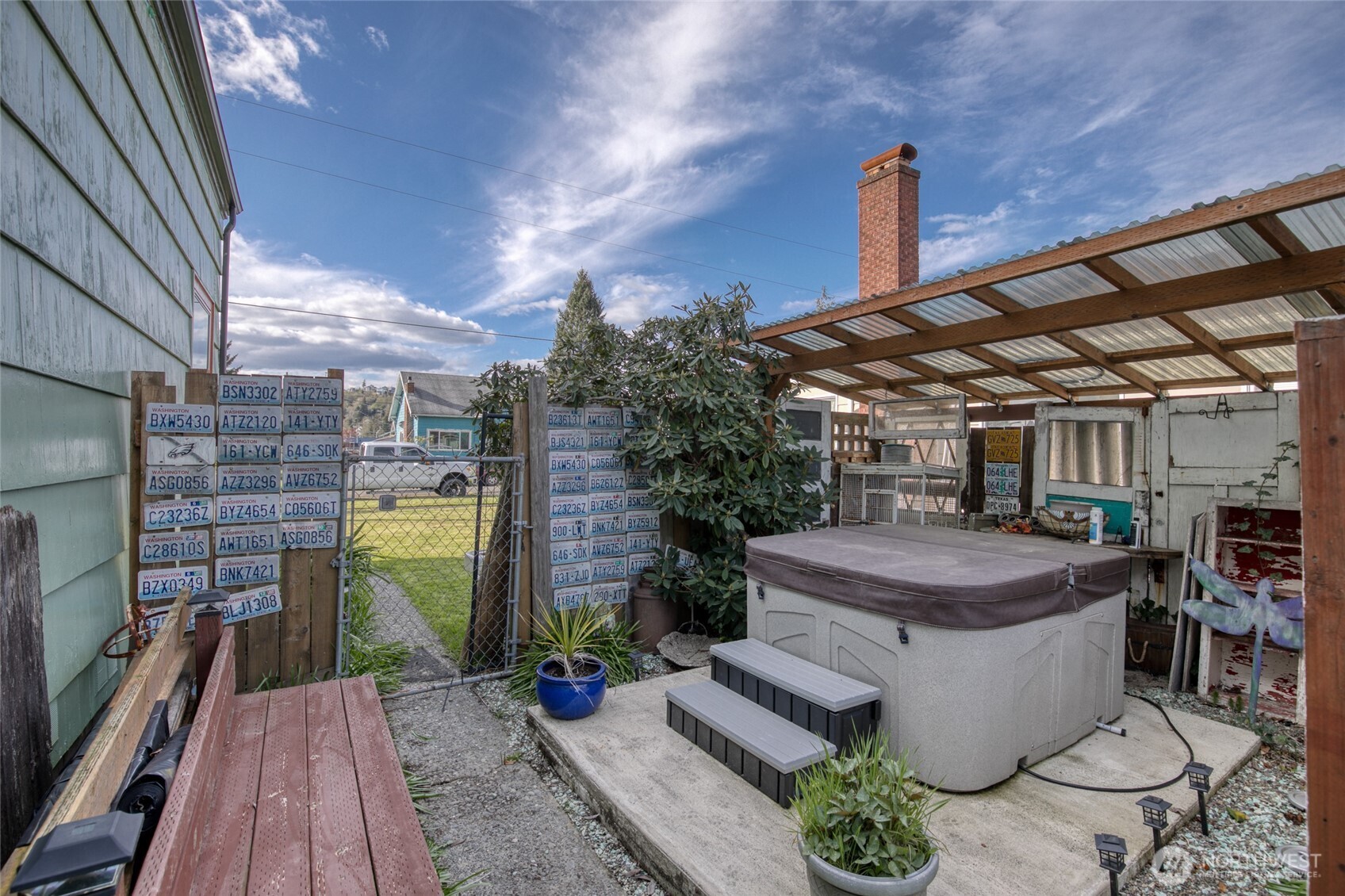 823 West 3rd Street Aberdeen, WA 98520 - Photo 28 of 40 a view of a patio with table and chairs and potted plants
