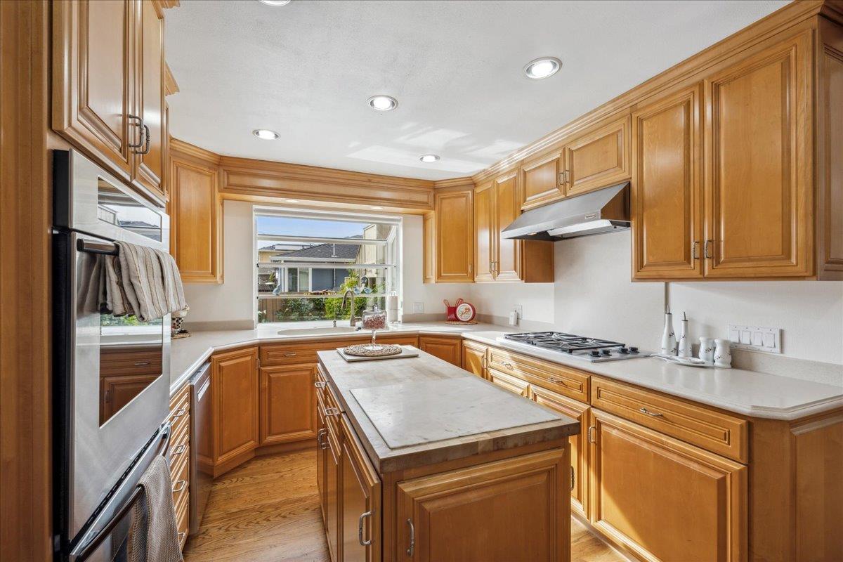 3726 Pasadena Drive San Mateo, CA 94403 - Photo 20 of 50 a kitchen that has a sink and a stove in it