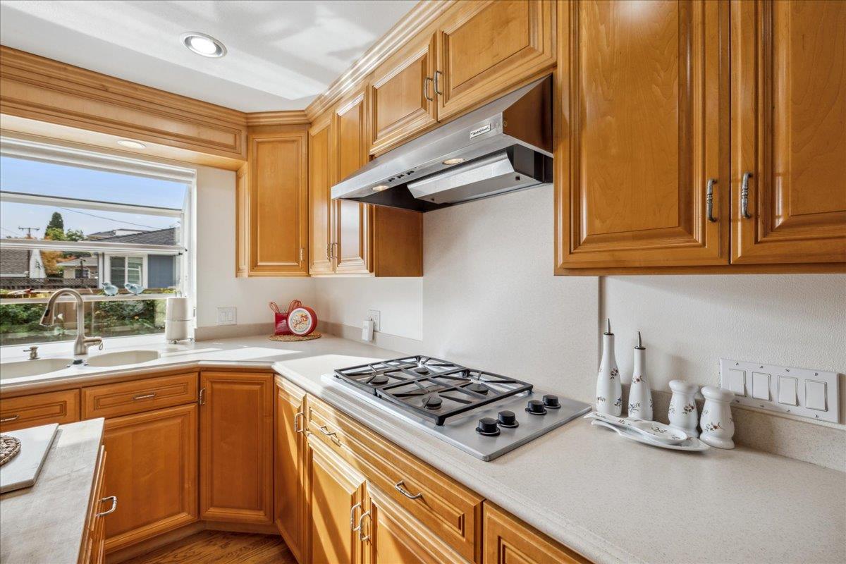 3726 Pasadena Drive San Mateo, CA 94403 - Photo 21 of 50 a kitchen with stainless steel appliances granite countertop a stove and a sink