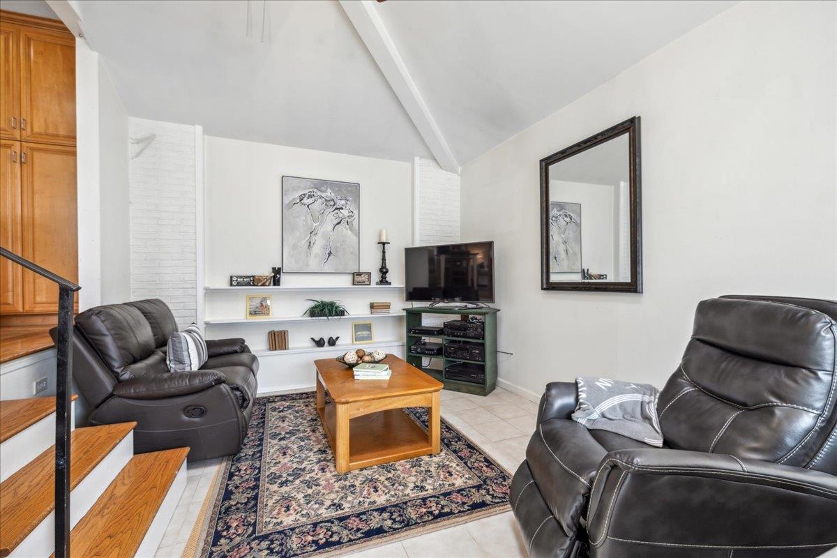 3726 Pasadena Drive San Mateo, CA 94403 - Photo 26 of 50 a living room with furniture and a flat screen tv
