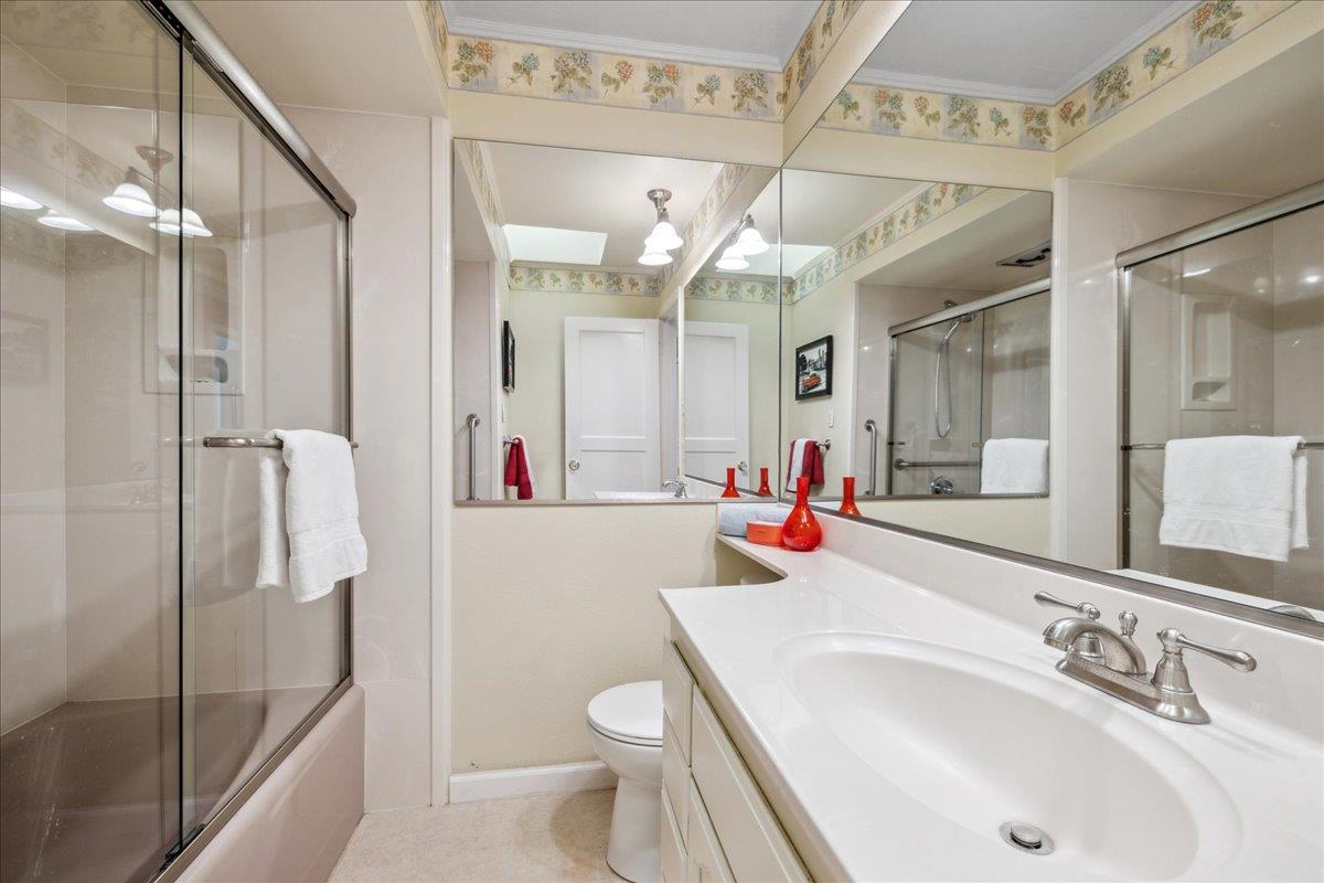 3726 Pasadena Drive San Mateo, CA 94403 - Photo 29 of 50 a bathroom with a sink a toilet and shower