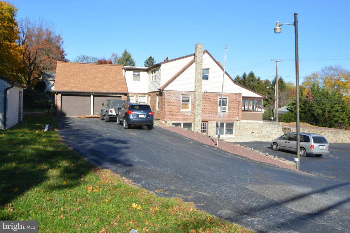 9 Hossler Road Manheim, PA 17545 - Photo 1 of 19 a view of a house with a small yard and sitting area