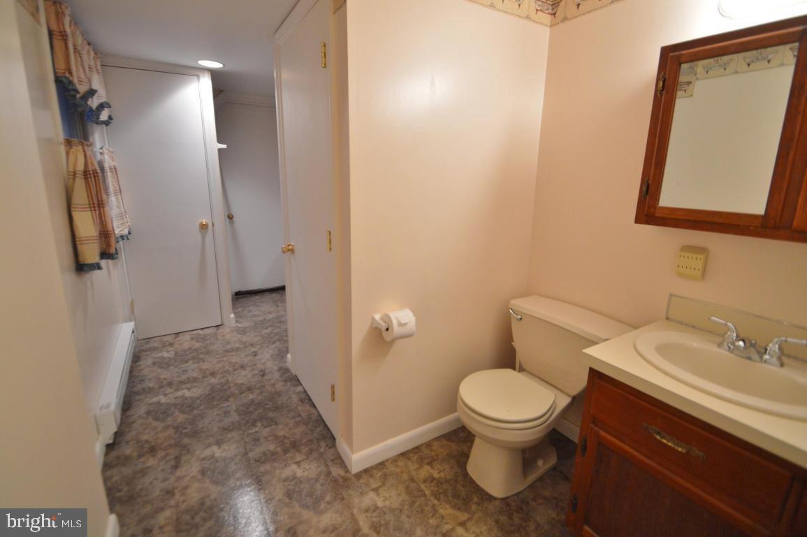 9 Hossler Road Manheim, PA 17545 - Photo 11 of 19 a bathroom with a toilet sink and mirror