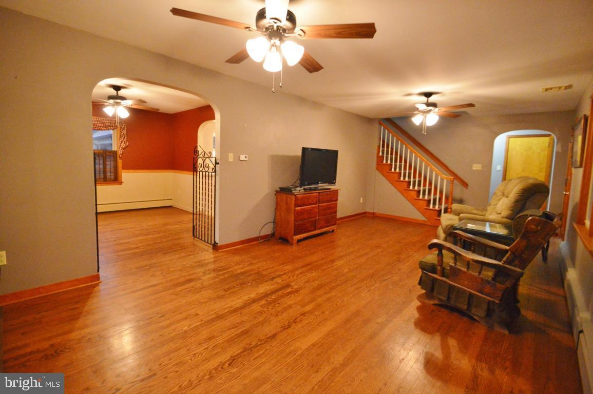9 Hossler Road Manheim, PA 17545 - Photo 6 of 19 a view of a livingroom with furniture a ceiling fan and wooden floor