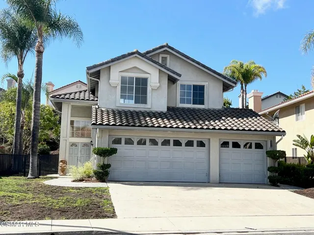 a front view of a house with a garage