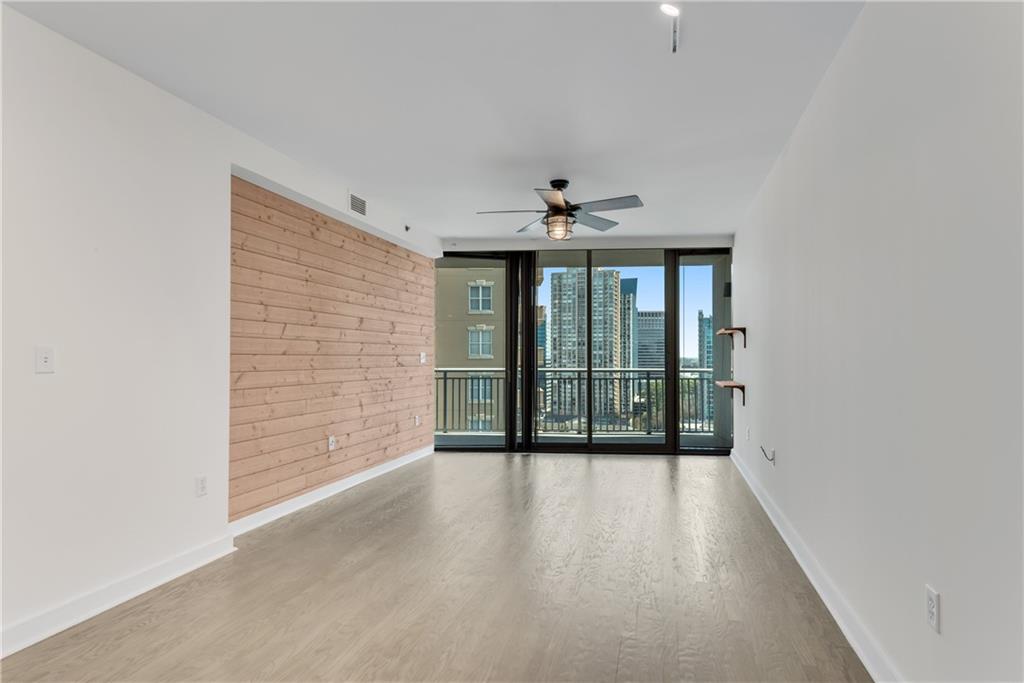 3338 Peachtree Road Northeast, Unit 1706 Atlanta, GA 30326 - Photo 11 of 37 a view of an empty room with glass door