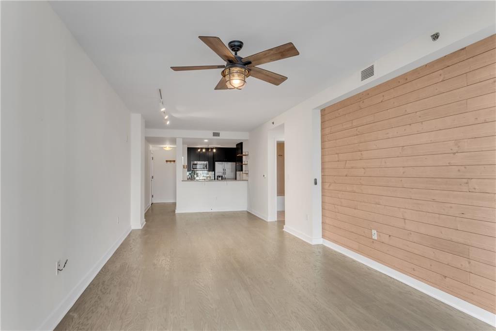 3338 Peachtree Road Northeast, Unit 1706 Atlanta, GA 30326 - Photo 15 of 37 a view of a livingroom with a ceiling fan & a ceiling fan
