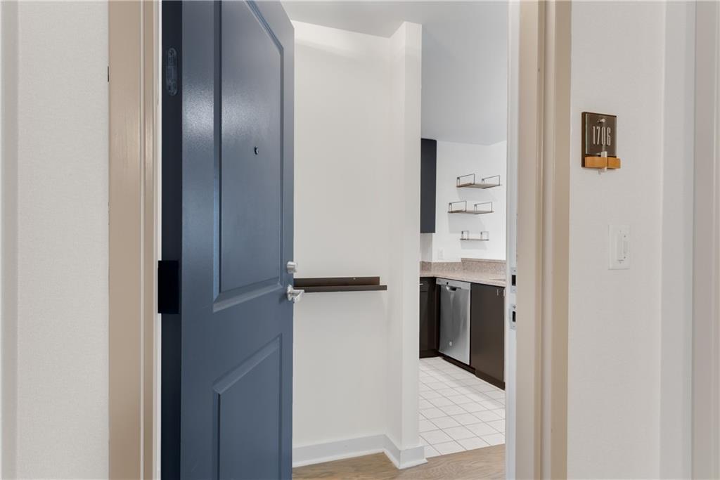 3338 Peachtree Road Northeast, Unit 1706 Atlanta, GA 30326 - Photo 22 of 37 a view of a hallway with wooden shelves