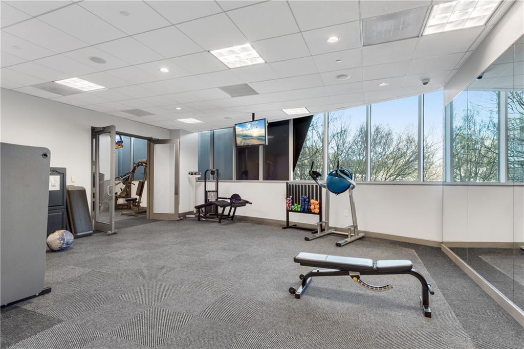 3338 Peachtree Road Northeast, Unit 1706 Atlanta, GA 30326 - Photo 24 of 37 a view of a room with gym equipment