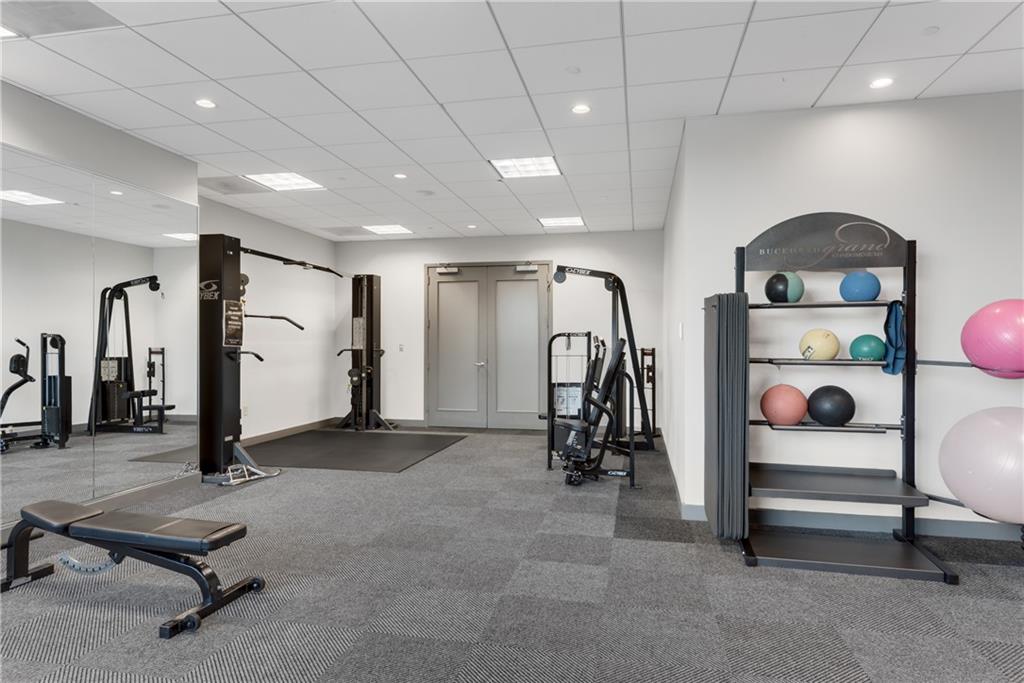 3338 Peachtree Road Northeast, Unit 1706 Atlanta, GA 30326 - Photo 25 of 37 a view of a room with gym equipment