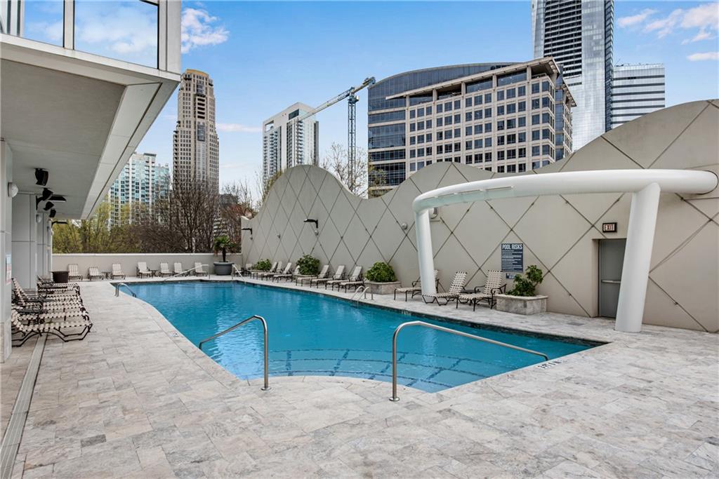 3338 Peachtree Road Northeast, Unit 1706 Atlanta, GA 30326 - Photo 27 of 37 a view of swimming pool with outdoor seating and barbeque oven
