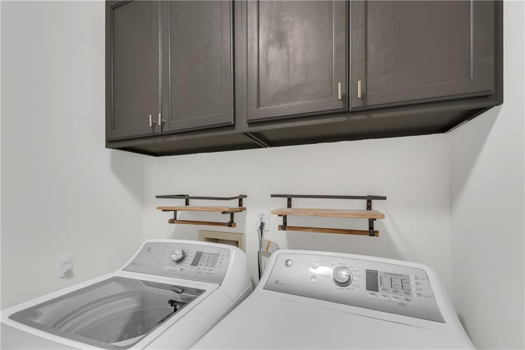 3338 Peachtree Road Northeast, Unit 1706 Atlanta, GA 30326 - Photo 9 of 37 a utility room with dryer and washer